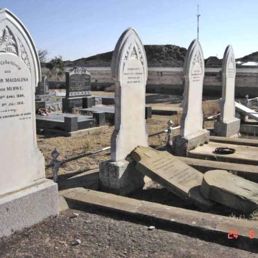 7 Graves within a railing